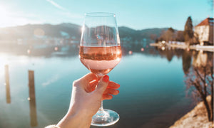 women holding wine glass